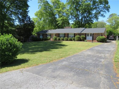 Lovely curb appeal, great landscaping and long dri