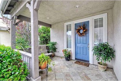 Tiled covered porch entry offers both a tranquil p