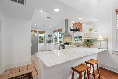 FRESHLY PAINTED CABINETRY AND MARBLE COUNTERTOPS