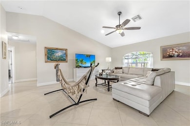 Living room featuring vaulted ceiling and ceiling