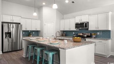 Kitchen with appliances with stainless steel finis