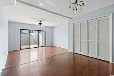 Interior space with a textured ceiling, ceiling fa