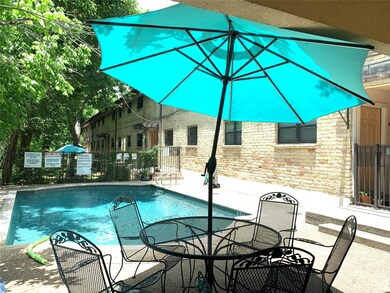 Community pool featuring a patio area and outdoor