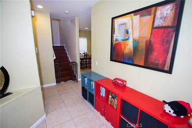 Front Entry Foyer - Privacy Wall helps separate children's play area entry from Living Room.  This custom built feature is unique to the complex!