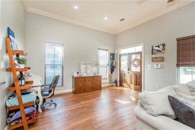 Living Room view with Entry and additional space.