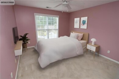 Bedroom with carpet floors and a ceiling fan