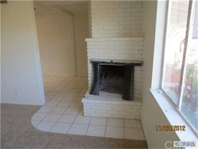 Another view of living room with fireplace.