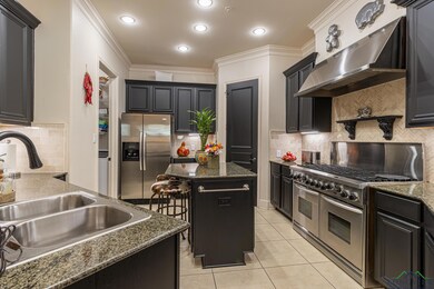 Kitchen featuring extractor fan, ornamental moldin
