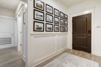 Entrance foyer featuring wood finished floors