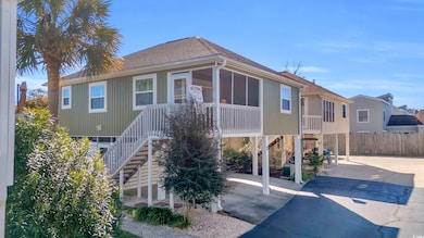 View of front of property featuring a carport