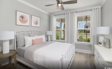 Bedroom featuring wood finished floors and a ceiling fan