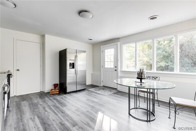 View of wood floored dining space