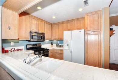 This wide opening to the kitchen provides a greatr