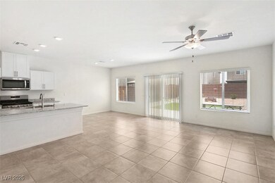 Kitchen with open floor plan, appliances with stai