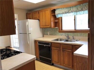 AS YOU ENTER THE KITCHEN FROM THE GARAGE
