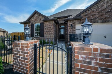 D.R. Horton/Freedom Homes builds your home with extra wide doorways and ramp access at your Garage Entry with Gorgeous Covered Front Porch Entry, Upgraded Coach Lighting to welcome you home in the evenings, Mahogany Wood & Glass Front Door and more! Outstanding Courtyard with Iron Gate!!