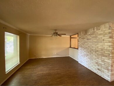 Formal living room with opening to family room.