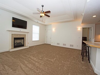 Living Room features a Gas Fireplace and large tre