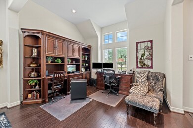 Another view of the formal living room being used as an open home office area.
