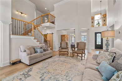 Staircase view featuring wrought iron railing