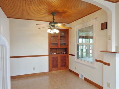 THE CHARMING DINING ROOM HAS A BUILT-IN HUTCH.