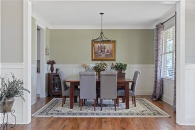 Lovely dining room with adjoining butler's pantry.