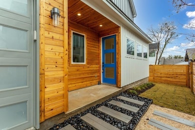 Doorway to property with board and batten siding