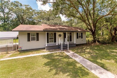 Great front porch with large shade tree for relaxi