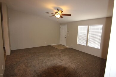 Vaulted Living Room with Ceiling Fan