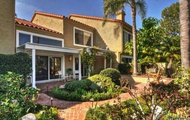 Rose Gardens and charming brick patio throughout t
