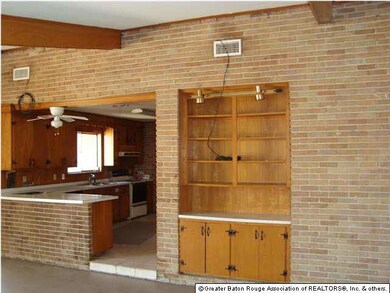The Kitchen opens to the Den/Dining room. Some bui