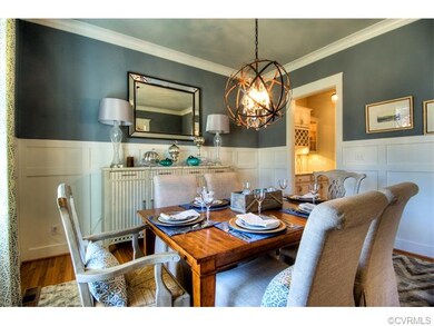 The elegant formal dining room is beautifully fini