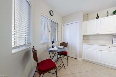 Dining area with light tile patterned flooring