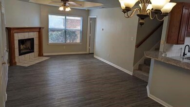 Unfurnished living room featuring ceiling fan with