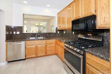 The kitchen is upgraded with stainless steel appli