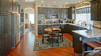 Large kitchen with lots of cabinets/storage.