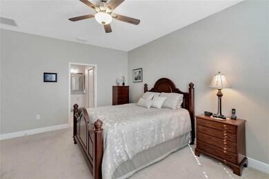 Master bedroom is carpeted and has ceiling fan