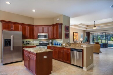 Spacious kitchen overlooks the living room and off