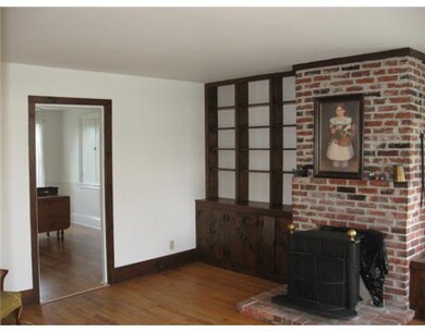 Living Room. Nice wood floors & wood...