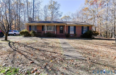 Single story home featuring a porch and brick siding