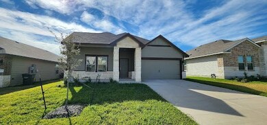 View of front facade featuring a garage and a fron