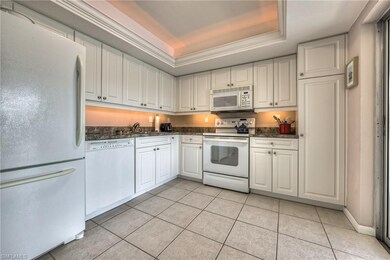 Nicely appointed kitchen with tray ceiling and dec