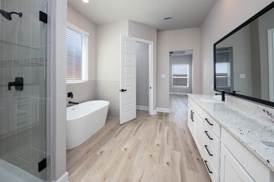 Experience serenity in the en-suite bathroom, wher