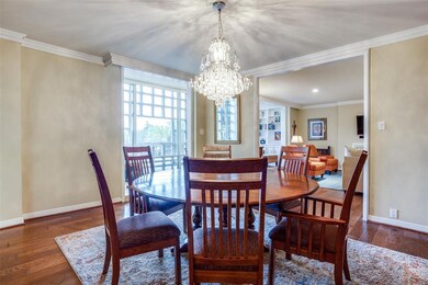 Dining room opens to living room, kitchen, and sun