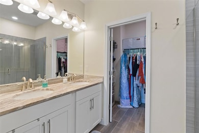 Double vanity and walk in closet. Separate toilet