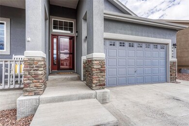 Covered Entry and front porch to enjoy views of the park and Colorado sunshine.