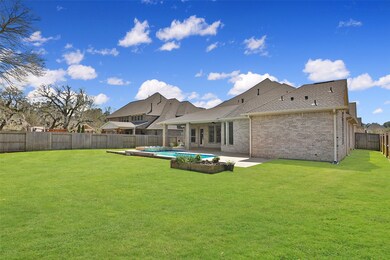 The four sided brick on this home will be appreciated for low maintenance. Notice the majestic mature trees that border in places as you tour this GATED COMMUNITY. This backyard offers extended outdoor living!