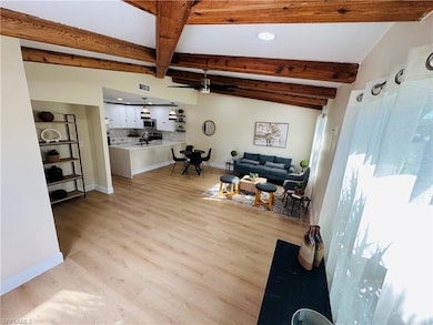 Living area featuring light wood-style floors, recessed lighting, and ceiling fan