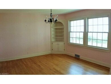 Dining room with refinished hardwood flooring and 