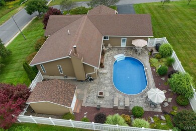 Fenced in pool area with a new stampcrete patio, b